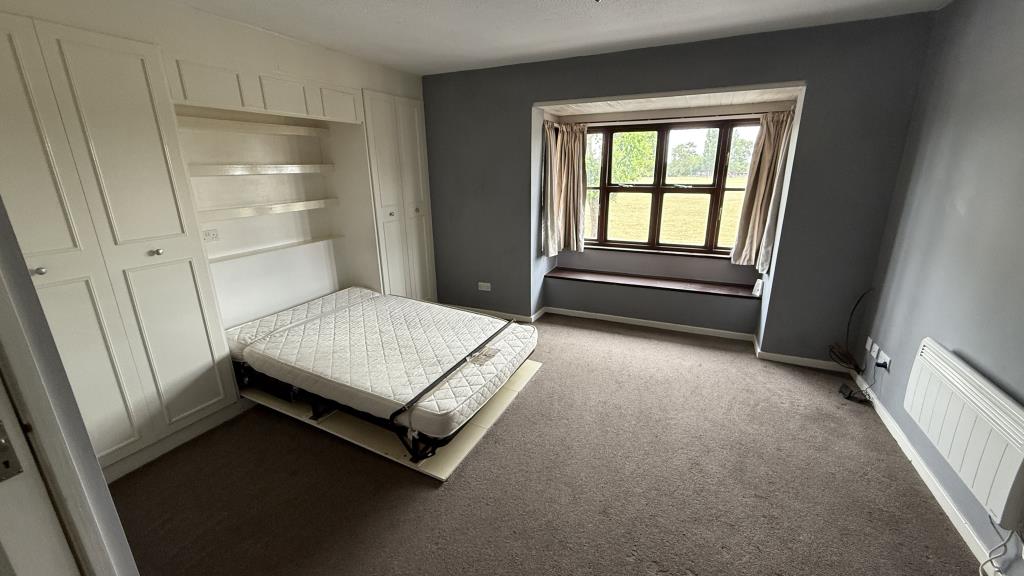Lot: 144 - VACANT STUDIO FLAT FOR INVESTMENT - Internal image of studio living area with bed down